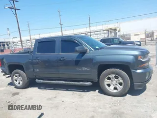 2018 Chevrolet Silverado 1500 LT with VIN 3GCUKREC1JG511846, listed as a IAAI auction lot 42024170 with 121,532 mi miles and . Bid and sale history available at DreamBid. Image 13.