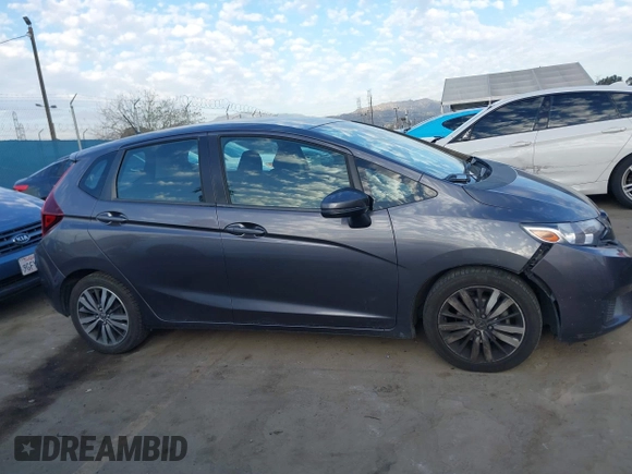 2015 Honda Fit LX with VIN 3HGGK5H5XFM719477, listed as a IAAI auction lot 41671194 with 145,876 mi miles. Bid and sale history available at carsss.com. Image 13.