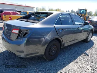 2014 Toyota Camry L with VIN 4T4BF1FK9ER423232, listed as a IAAI auction lot 41980213 with 157,132 mi miles. Bid and sale history available at carsss.com. Image 4.