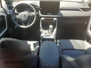 2023 Toyota RAV4 Hybrid XSE with VIN 2T3E6RFV9PW039963, listed as a Copart auction lot 57594335 with 27,486 mi miles and Salvage title. Bid and sale history available at DreamBid. Image 8.