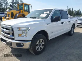 2015 Ford F-150 XLT with VIN 1FTEW1EP4FKE54734, listed as a IAAI auction lot 42137158 with 153,991 mi miles. Bid and sale history available at carsss.com. Image 2.