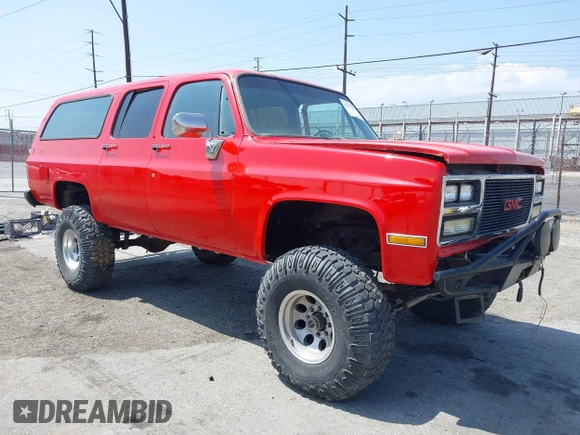 1991 GMC Suburban z VIN 1GKGR26N7MF513031, wystawiony jako IAAI lot #42179575 z przebiegiem 68 871 mil mil oraz . Historia ofert i sprzedaży dostępna na DreamBid. Obrazek 1.