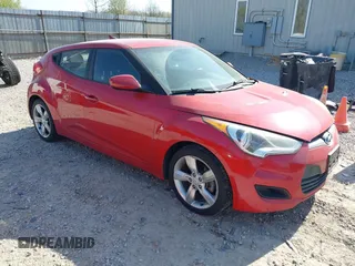 2014 Hyundai Veloster with VIN KMHTC6AD2EU214847, listed as a IAAI auction lot 42067728 with 77,421 mi miles. Bid and sale history available at carsss.com. Image 1.
