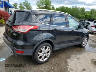 2015 Ford Escape Titanium with VIN 1FMCU0JX5FUA24210, listed as a Copart auction lot 57270855 with 115,613 mi miles and Salvage title. Bid and sale history available at DreamBid. Image 3.