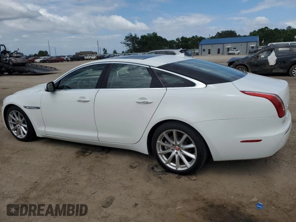 2015 Jaguar XJ with VIN SAJWA1CZ9F8V82974, listed as a Copart auction lot 59364344 with 64,012 mi miles and Salvage Title. Bid and sale history available at carsss.com. Image 2.
