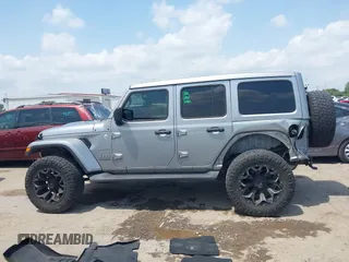 2021 Jeep Wrangler Unlimited High Altitude with VIN 1C4HJXEG3MW511185, listed as a IAAI auction lot 42125883 with 45,564 mi miles and . Bid and sale history available at DreamBid. Image 14.