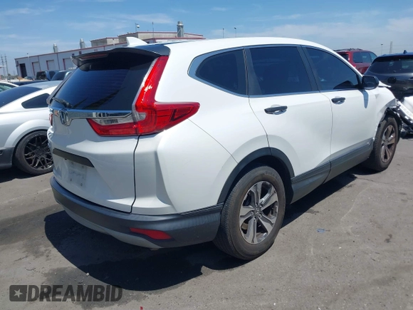 2019 Honda CR-V LX with VIN 2HKRW5H33KH407463, listed as a IAAI auction lot 42034584 with 85,454 mi miles and . Bid and sale history available at DreamBid. Image 4.