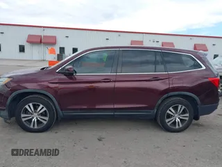 2016 Honda Pilot EX-L with VIN 5FNYF5H58GB026209, listed as a IAAI auction lot 41333088 with 129,484 mi miles and . Bid and sale history available at DreamBid. Image 14.