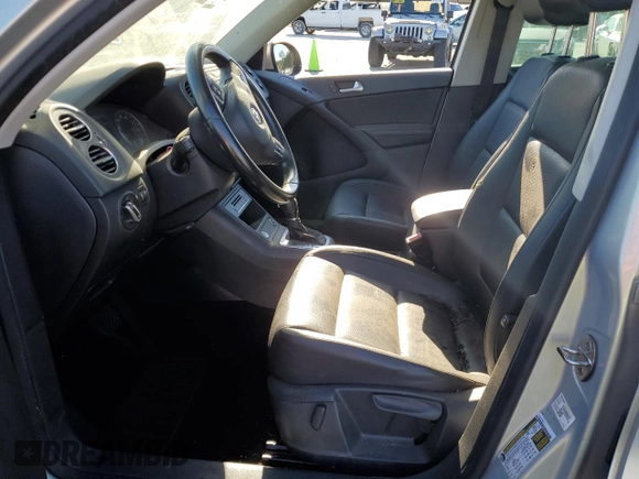 2014 Volkswagen Tiguan SE with VIN WVGAV3AX9EW611860, listed as a Copart auction lot 74431754 with 116,022 mi miles and Salvage title. Bid and sale history available at DreamBid. Image 7.