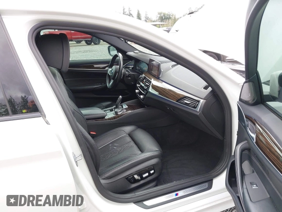 2019 BMW 5 Series 530e with VIN WBAJA9C57KB389401, listed as a IAAI auction lot 42565098 with 52,343 mi miles and . Bid and sale history available at DreamBid. Image 5.