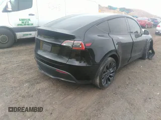 2022 Tesla Model Y Performance with VIN 7SAYGDEF6NF530388, listed as a IAAI auction lot 39253462 with 21,393 mi miles and . Bid and sale history available at DreamBid. Image 4.