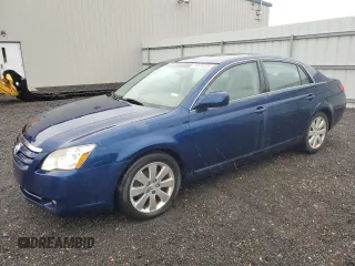 2005 Toyota Avalon XL z VIN 4T1BK36B75U059880, wystawiony jako Copart lot #56694285 z przebiegiem 249 215 mil mil oraz Czysty tytuł • Clean title. Historia ofert i sprzedaży dostępna na DreamBid. Obrazek 1.