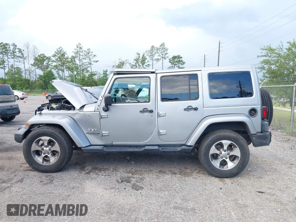 2016 Jeep Wrangler Unlimited Sahara with VIN 1C4BJWEG3GL240859, listed as a IAAI auction lot 42628937 with 103,378 mi miles and . Bid and sale history available at DreamBid. Image 14.