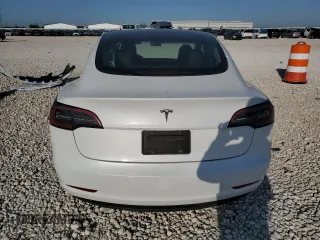 2023 Tesla Model 3 with VIN 5YJ3E1EA4PF631304, listed as a Copart auction lot 52500695 with 33,024 mi miles and Salvage title. Bid and sale history available at DreamBid. Image 6.