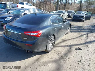 2014 Maserati Ghibli S Q4 with VIN ZAM57RTA1E1091738, listed as a IAAI auction lot 41518359 with 75,641 mi miles. Bid and sale history available at carsss.com. Image 4.