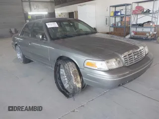 2000 Ford Crown Victoria LX z VIN 2FAFP74W8YX142015, wystawiony jako IAAI lot #41767918 z przebiegiem 257 728 mil mil oraz . Historia ofert i sprzedaży dostępna na DreamBid. Obrazek 1.