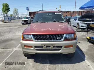 1999 Mitsubishi Montero LS z VIN JA4LS31H1XP034327, wystawiony jako Copart lot #52573485 z przebiegiem 286 753 mil mil oraz Szkoda całkowita • Salvage title. Historia ofert i sprzedaży dostępna na DreamBid. Obrazek 5.