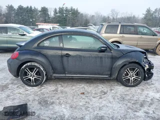 2012 Volkswagen Beetle 2.5L PZEV with VIN 3VWJP7AT8CM619137, listed as a IAAI auction lot 41195954 with 157,741 mi miles. Bid and sale history available at carsss.com. Image 13.