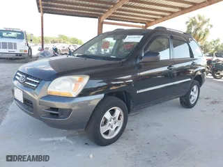 2007 Kia Sportage LX with VIN KNDJF724877450962, listed as a IAAI auction lot 41918290 with 216,476 mi miles. Bid and sale history available at carsss.com. Image 2.
