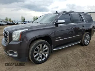 2015 GMC Yukon SLT z VIN 1GKS2BKCXFR269881, wystawiony jako Copart lot #57678175 z przebiegiem 256 703 mil mil oraz Czysty tytuł • Clean title. Historia ofert i sprzedaży dostępna na DreamBid. Obrazek 1.