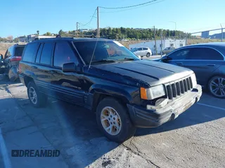 1998 Jeep Grand Cherokee Limited with VIN 1J4GX78Y8WC110325, listed as a IAAI auction lot 41357373 with 165,106 mi miles. Bid and sale history available at carsss.com. Image 1.