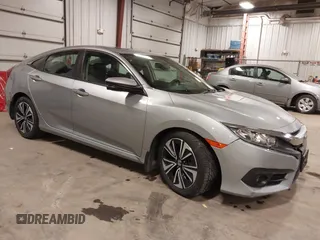 2018 Honda Civic EX-L z VIN 19XFC1F7XJE003895, wystawiony jako IAAI lot #41690710 z przebiegiem 61 110 mil mil oraz . Historia ofert i sprzedaży dostępna na DreamBid. Obrazek 1.