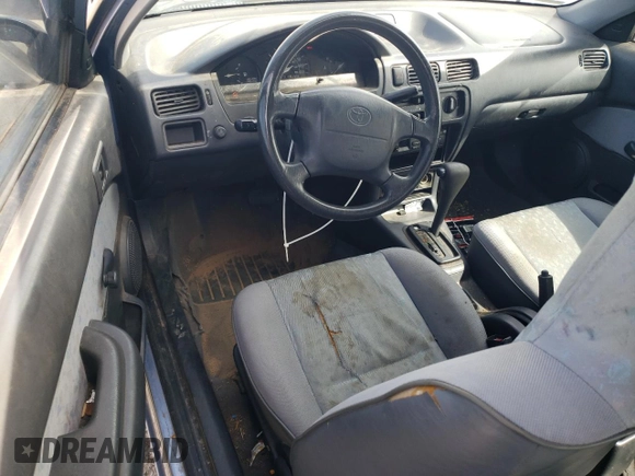 1997 Toyota Tercel CE z VIN JT2AC52L7V0212023, wystawiony jako Copart lot #49150285 z przebiegiem 74 742 mil mil oraz Czysty tytuł • Clean title. Historia ofert i sprzedaży dostępna na DreamBid. Obrazek 8.