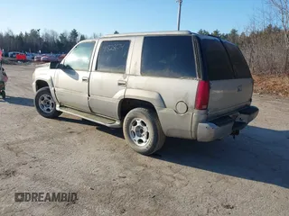 2000 GMC Denali with VIN 1GKEK13R7YR159609, listed as a IAAI auction lot 41828674 with 231,627 mi miles. Bid and sale history available at carsss.com. Image 3.