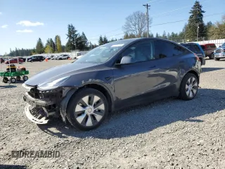 2020 Tesla Model Y Long Range with VIN 5YJYGDEEXLF017789, listed as a Copart auction lot 52705185 with 49,470 mi miles and Salvage Title. Bid and sale history available at DreamBid. Image 1.