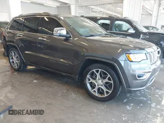 2020 Jeep Grand Cherokee Overland with VIN 1C4RJFCGXLC419668, listed as a IAAI auction lot 41608508 with 104,088 mi miles. Bid and sale history available at carsss.com. Image 1.