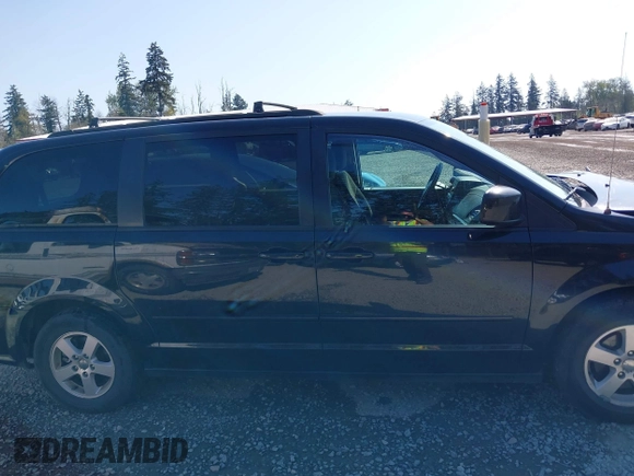 2012 Dodge Grand Caravan SXT with VIN 2C4RDGCG2CR319651, listed as a IAAI auction lot 42097594 with 155,521 mi miles and . Bid and sale history available at DreamBid. Image 13.