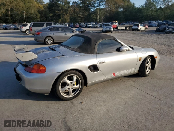 1998 Porsche Boxster с VIN WP0CA2987WS620369, выставлен на аукционе Copart как лот 81003964 с пробегом Не указан миль и Списание • Salvage title. История ставок и продаж доступна на DreamBid. Изображение 3.