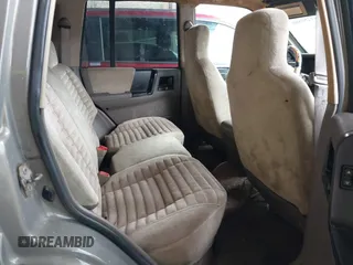 1995 Jeep Grand Cherokee Laredo with VIN 1J4GZ58SXSC697003, listed as a IAAI auction lot 41259889 with 248,595 mi miles. Bid and sale history available at carsss.com. Image 8.