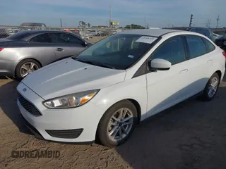 2018 Ford Focus SE z VIN 1FADP3F23JL328462, wystawiony jako IAAI lot #42068209 z przebiegiem 63 194 mil mil oraz . Historia ofert i sprzedaży dostępna na DreamBid. Obrazek 2.