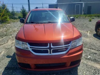 2013 Dodge Journey American Value z VIN 3C4PDCAB1DT656317, wystawiony jako Copart lot #58525885 z przebiegiem 210 834 mil mil oraz Szkoda całkowita • Salvage title. Historia ofert i sprzedaży dostępna na DreamBid. Obrazek 5.