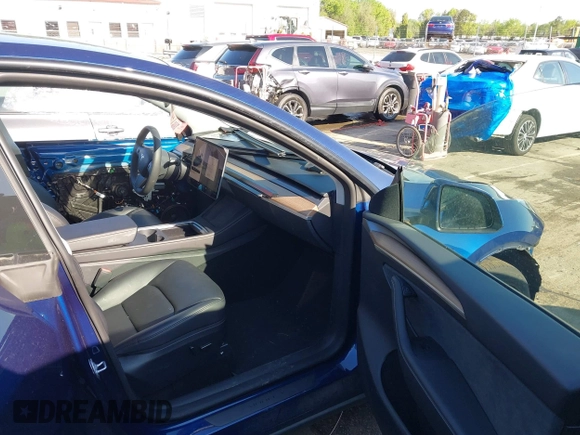 2023 Tesla Model Y Long Range with VIN 7SAYGDEE0PF762592, listed as a IAAI auction lot 41983933 with 28,510 mi miles and . Bid and sale history available at carsss.com. Image 5.