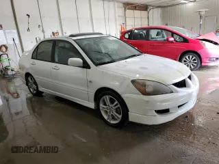2004 Mitsubishi Lancer with VIN JA3AJ66F64U029144, listed as a Copart auction lot 77437234 with 158,049 mi miles and Salvage Title. Bid and sale history available at DreamBid. Image 4.