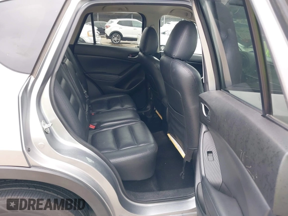 2014 Mazda CX-5 Touring z VIN JM3KE2CY8E0369145, wystawiony jako IAAI lot #42462985 z przebiegiem 155 480 mil mil oraz . Historia ofert i sprzedaży dostępna na DreamBid. Obrazek 8.