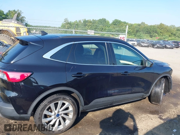 2021 Ford Escape Titanium Hybrid with VIN 1FMCU9DZ0MUB14833, listed as a IAAI auction lot 42593983 with 51,852 mi miles and . Bid and sale history available at DreamBid. Image 14.