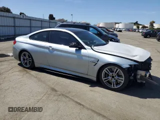 2015 BMW M4 with VIN WBS3R9C52FK334020, listed as a Copart auction lot 51867985 with 95,369 mi miles and Salvage title. Bid and sale history available at DreamBid. Image 4.