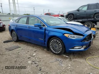 2017 Ford Fusion Hybrid Titanium with VIN 3FA6P0RU1HR138725, listed as a Copart auction lot 56650625 with 77,331 mi miles and Salvage title. Bid and sale history available at DreamBid. Image 4.