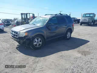 2011 Ford Escape XLT with VIN 1FMCU0D79BKB79697, listed as a IAAI auction lot 41265677 with 138,026 mi miles. Bid and sale history available at carsss.com. Image 2.
