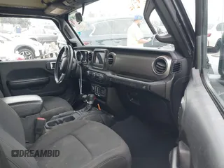 2021 Jeep Wrangler Sport with VIN 1C4GJXAN5MW627228, listed as a IAAI auction lot 42170010 with 56,965 mi miles and . Bid and sale history available at DreamBid. Image 5.