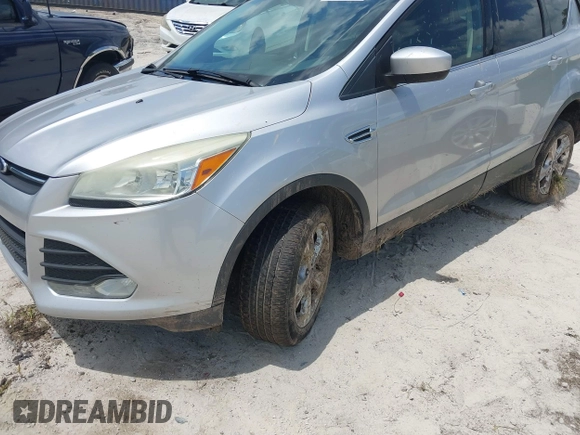 2014 Ford Escape SE with VIN 1FMCU9G9XEUD91390, listed as a IAAI auction lot 42561849 with 319,400 mi miles and . Bid and sale history available at DreamBid. Image 18.