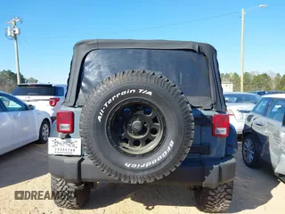 2015 Jeep Wrangler Sport with VIN 1C4AJWAG0FL591213, listed as a IAAI auction lot 41893306 with 107,807 mi miles and . Bid and sale history available at DreamBid. Image 16.