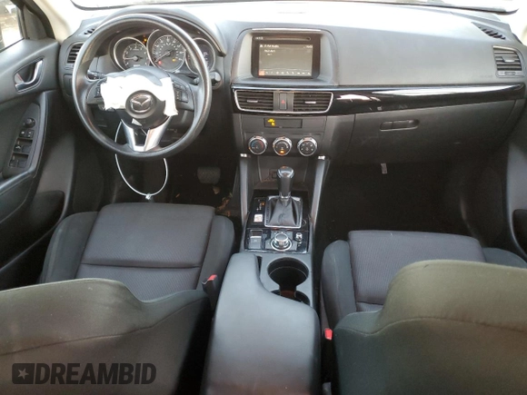 2016 Mazda CX-5 Sport with VIN JM3KE2BY9G0771969, listed as a Copart auction lot 80966064 with 99,348 mi miles and Salvage title. Bid and sale history available at DreamBid. Image 8.