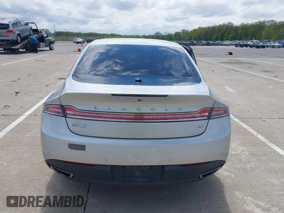 2015 Lincoln MKZ z VIN 3LN6L2GK5FR622117, wystawiony jako IAAI lot #42164455 z przebiegiem 167 156 mil mil oraz . Historia ofert i sprzedaży dostępna na DreamBid. Obrazek 16.