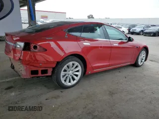 2017 Tesla Model S 100D with VIN 5YJSA1E29HF229425, listed as a Copart auction lot 54602195 with 128,886 mi miles and Salvage Title. Bid and sale history available at DreamBid. Image 3.
