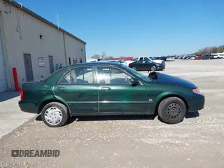 2001 Mazda Protege LX with VIN JM1BJ225310404647, listed as a IAAI auction lot 41480466 with 115,606 mi miles and . Bid and sale history available at carsss.com. Image 13.