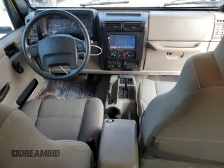 2003 Jeep Wrangler Sahara with VIN 1J4FA59S03P313418, listed as a Copart auction lot 64883094 with 184,658 mi miles and Salvage title. Bid and sale history available at DreamBid. Image 8.